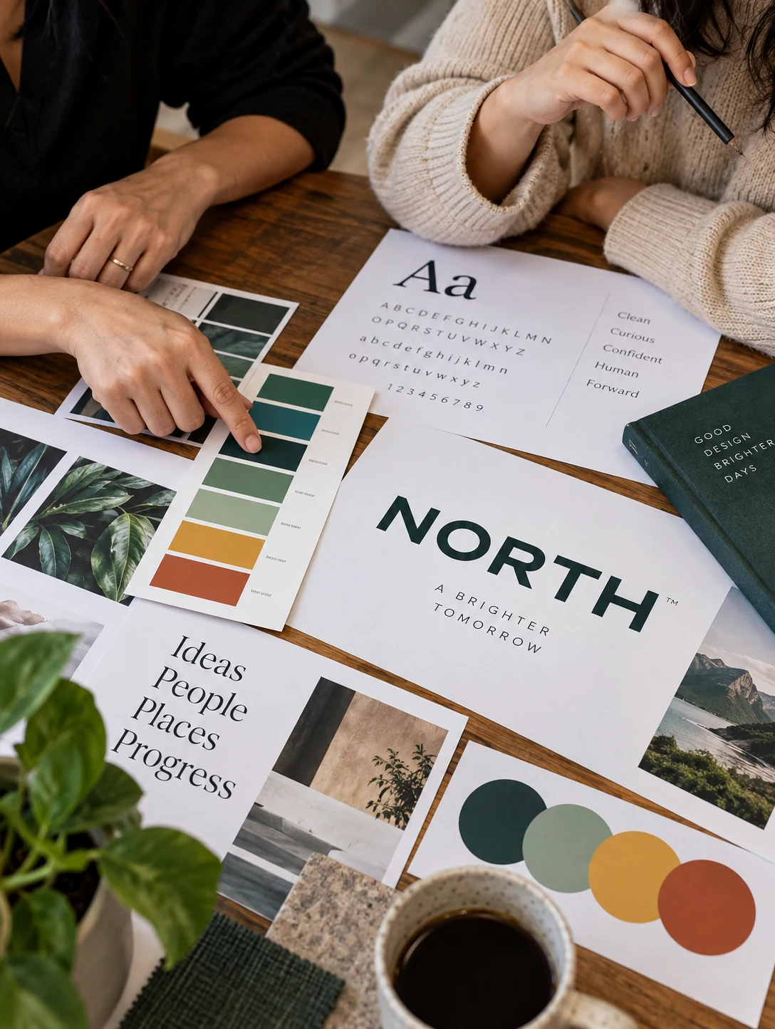 Two designers choosing a color palette and type pairing around a table
