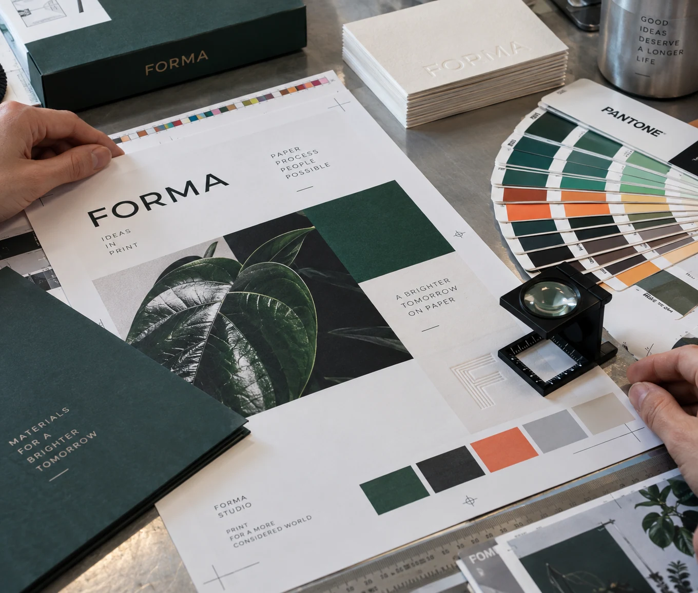 Professional print proofing: crop marks, spot-color swatches, typography and a loupe on high-quality printed stationery