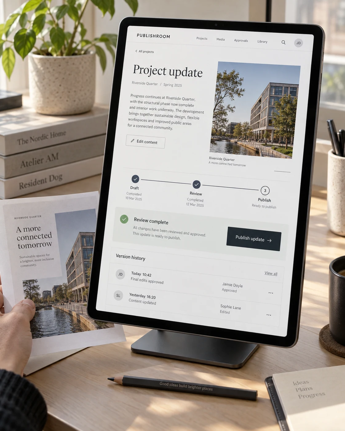 Content approval and version history inside a tablet beside a publishing plan